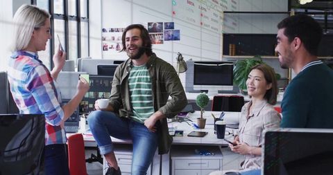 Creative team collaborating in modern workspace