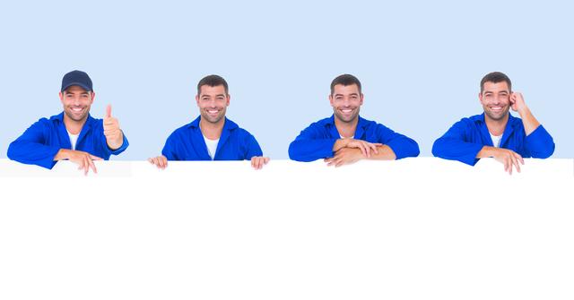 Men wearing blue uniforms hold a blank sign with a cheerful expression, perfect for promotional content. Suitable for themes such as advertisement, construction services, professional presentations, and business communication.