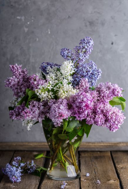 Vase of Colorful Lilac Flowers on Rustic Wooden Table - Download Free Stock Photos Pikwizard.com