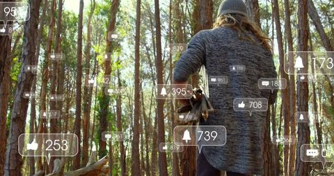Walking sunlit pine forest carrying firewood with floating social media notifications