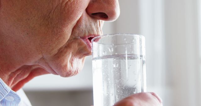 Close-up of Elderly Person Drinking Water from Glass - Download Free Stock Images Pikwizard.com