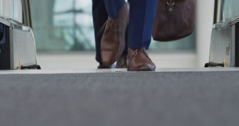 Businessman's Busy Commute on Escalator in Modern Building - Download Free Stock Images Pikwizard.com