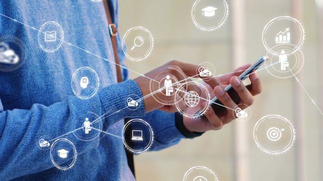 Businessman interacting with smartphone as digital network icons surround him implies connectivity and technological advancement. Useful for illustrating global communication, business strategies, or the integration of technology in business settings.