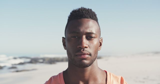 African American Man Facing Camera at Beach on Sunny Day - Download Free Stock Images Pikwizard.com