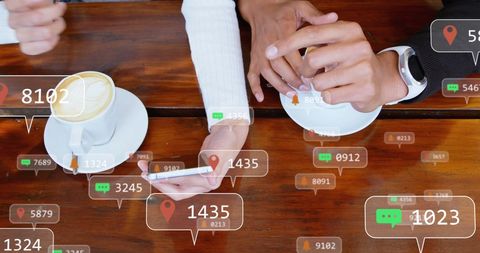 Business Colleagues Discussing Digital Engagement at Cafe