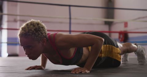 Biracial Female Boxer Training with Push-Ups in Boxing Ring - Download Free Stock Images Pikwizard.com