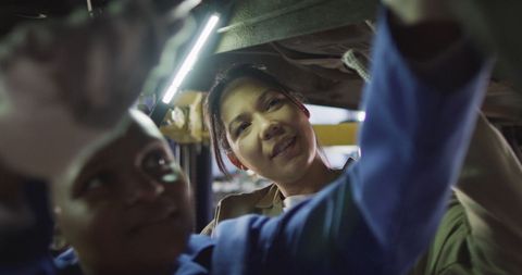 Diverse Female Mechanics Repairing Car in Auto Workshop - Download Free Stock Images Pikwizard.com