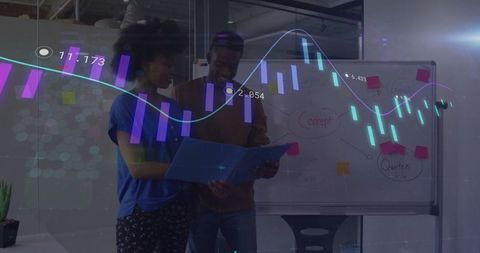 Coworkers Collaborating on Data Analytics in Modern Office Environment