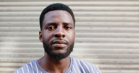Confident young african american man with striped shirt