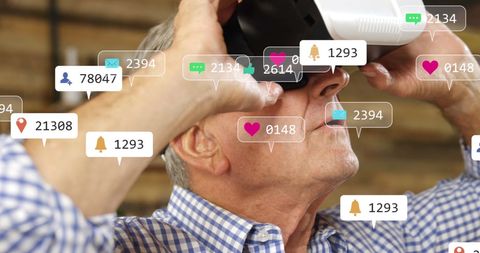 Senior man engaging with social media via vr technology