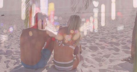 Romantic beach sunset with couple enjoying serenity