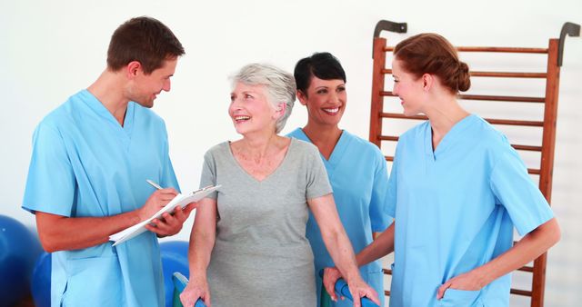 Medical Staff Assisting Elderly Woman in Rehabilitation Center - Download Free Stock Images Pikwizard.com