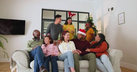 Diverse Family Celebrating Festive Holiday Around Sofa