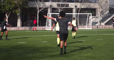 Youth Soccer Players Demonstrating Teamwork During Competitive Match