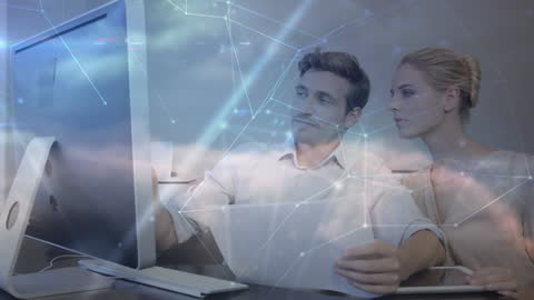Caucasian Couple Reviewing Finances and Networking Technology Systems