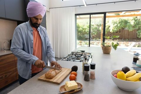 Mid Adult Man Preparing Healthy Breakfast in Modern Kitchen