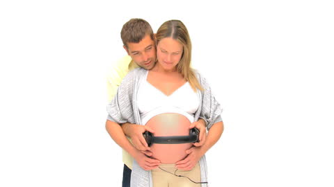 Expectant Couple Sharing Music with Unborn Baby