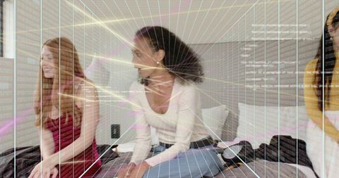 Friends posing on bed with digital grid overlay for fashion lifestyle augmented reality