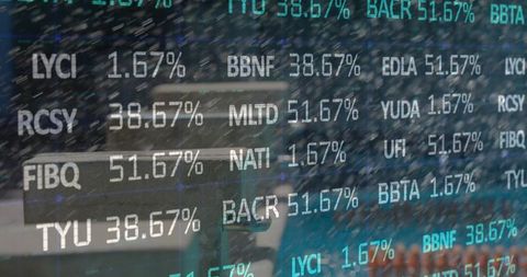 Digital stock market display over café table with laptop