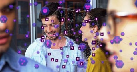 Diverse Professionals Connected by Digital Network in Office