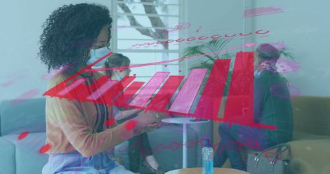 Colleagues Analyzing Digital Interface with COVID-19 Precautions in Office