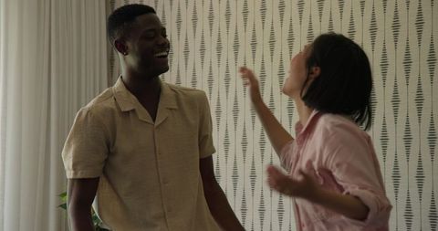 Interracial Couple Joyful Interaction at Home Celebration