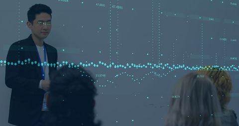 Businessman Delivering Data-Driven Presentation to Colleagues