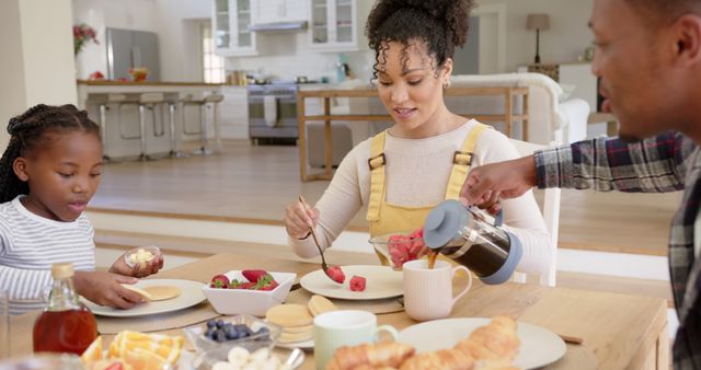 Family Enjoying Breakfast at Table in Bright Modern Kitchen - Download Free Stock Images Pikwizard.com