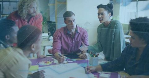 Diverse team collaborating on creative design project in modern office