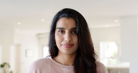 Confident Woman in Modern Living Room Embracing Contemporary Lifestyle