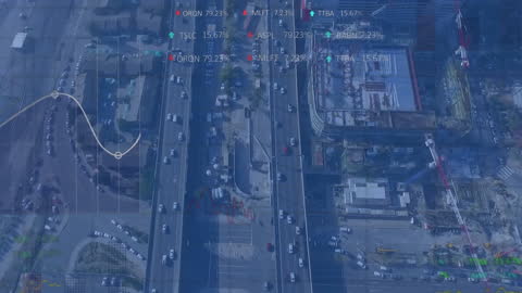 Financial Data Processing Overlaid on Urban Aerial View