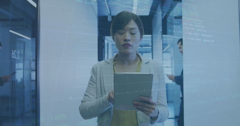 Businesswoman Analyzing Stock Market Data on Tablet Device