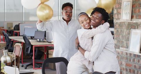 Joyful Office Celebration with Colleagues and Balloons