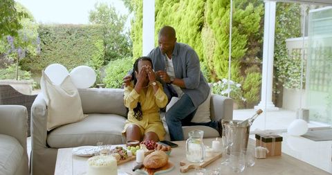 Surprise Celebration for Young Woman Covering Her Eyes