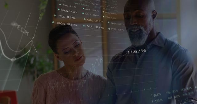 Couple Analyzing Stock Market Data on Transparent Screen - Download Free Stock Images Pikwizard.com