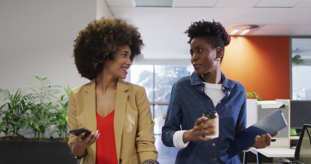 Businesswomen Networking with Coffee in Modern Office - Download Free Stock Images Pikwizard.com