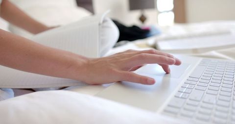 Teenage Girl Typing on Laptop with Notebook in Relaxed Home Setting - Download Free Stock Images Pikwizard.com