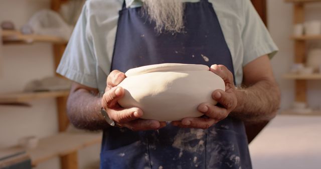 Potter Holding Freshly Crafted Ceramic Bowl in Studio - Download Free Stock Images Pikwizard.com