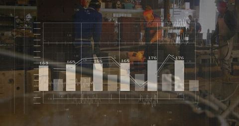 Industry Workers Analyzing Data in Manufacturing Environment