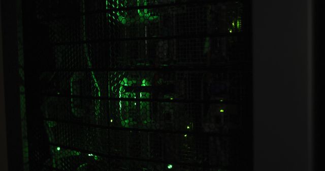 Server racks with green LED lights indicating active network and data processing. Useful for illustrating modern technology infrastructure, internet services, cloud computing, and cybersecurity themes.