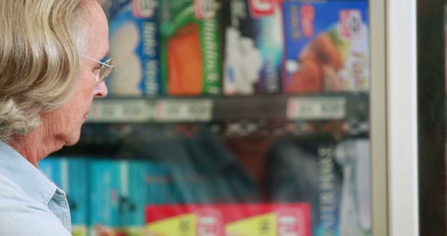 Senior Man Shopping for Frozen Foods in Supermarket - Download Free Stock Images Pikwizard.com