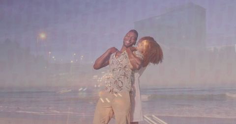 Couple Embracing on Tranquil Beach at Dusk