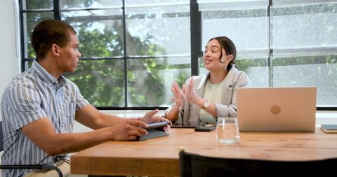 Multiracial Business Team Having Conversation in Modern Office