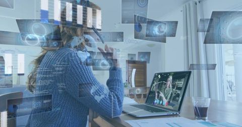 Remote worker analyzing business dashboards during video meeting in modern home office