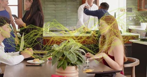 Young professionals networking in modern coworking kitchen with digital wireframe overlay
