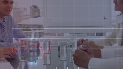 Business Colleagues Analyzing Data in Modern Office Meeting