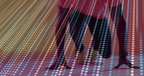 Vibrant Dance Performance with LED Lights and High Heels