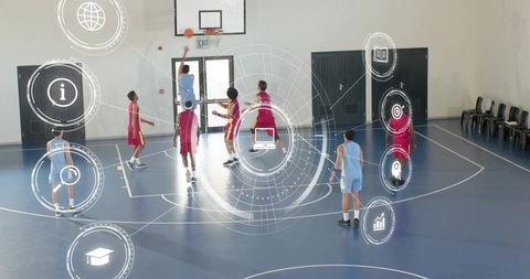 Basketball players shooting and defending with digital analytics overlay in indoor court