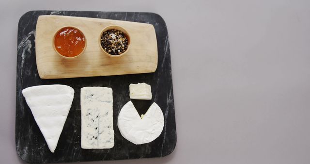 Gourmet Cheese Variety with Condiments on Cutting Board - Download Free Stock Images Pikwizard.com