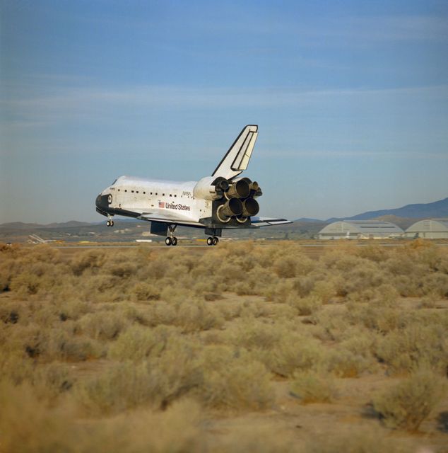 STS029-S-064 (18 Mar 1989) --- A rear view photographed from the ground just after Discovery's main landing gear touches down on Runway 22 at Edwards Air Force Base in California following a successful five-day mission in Earth orbit.  Onboard the spacecraft were Astronauts Michael L. Coats, John E. Blaha, James F. Buchli, Robert C. Springer and James P. Bagian.  Wheels came to a stop at 6:36:40 a.m. (PST), March 18, 1989.